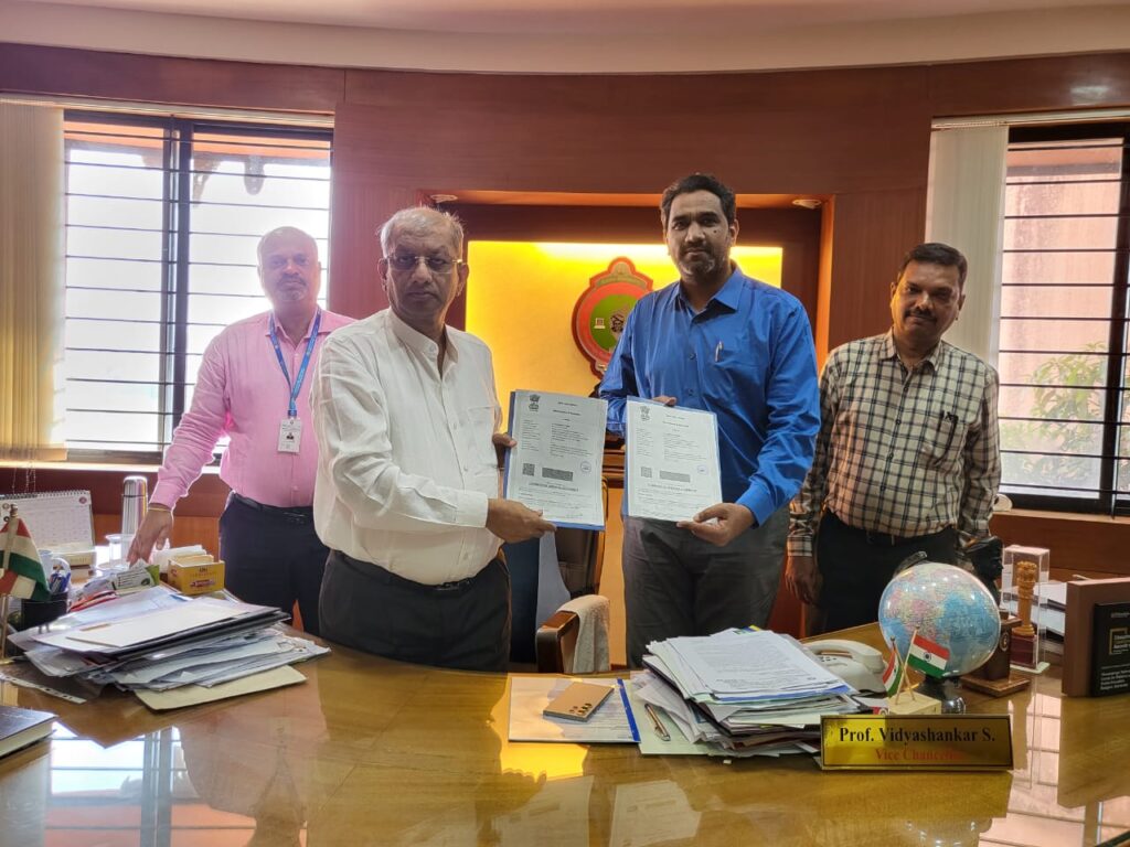 Photo of MR.HarishNath and Mr. Madhu with Vice Chancellor of VTU